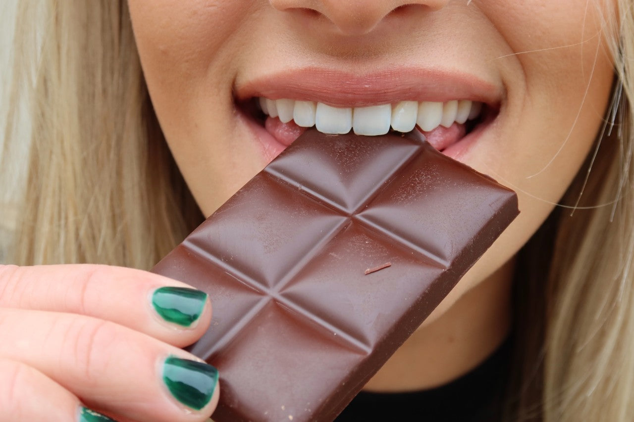 customer eating our sweet dark chocolate